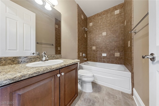 full bathroom with vanity, toilet, and tiled shower / bath