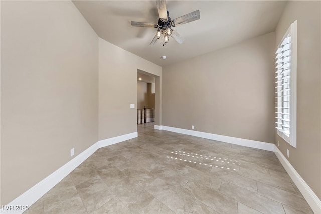 spare room featuring ceiling fan