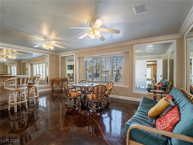 dining space featuring a textured ceiling, plenty of natural light, ornamental molding, and ceiling fan