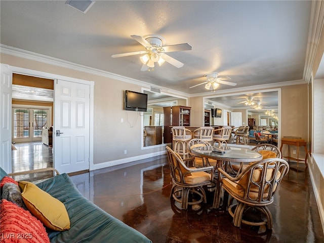 dining room with crown molding and ceiling fan