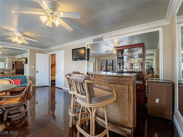 bar with a textured ceiling and crown molding