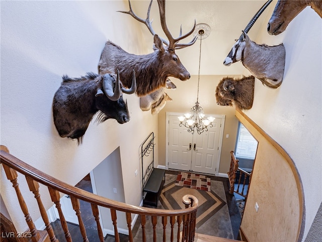 foyer featuring a chandelier