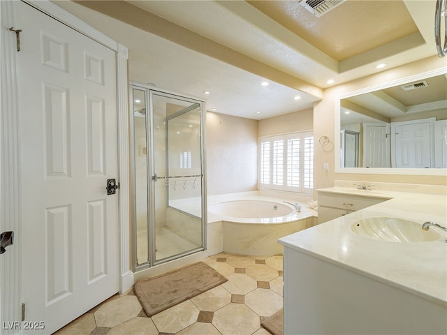 bathroom with shower with separate bathtub, vanity, and a raised ceiling