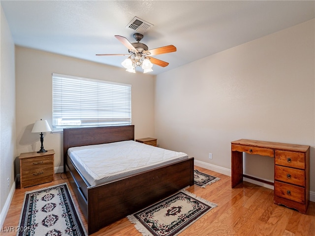 bedroom featuring light hardwood / wood-style floors and ceiling fan