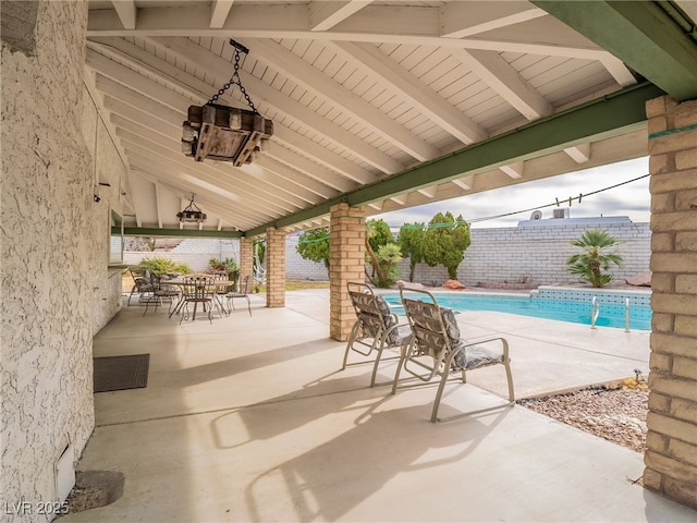 view of patio with a fenced in pool