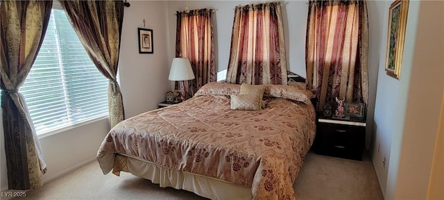 bedroom with light colored carpet