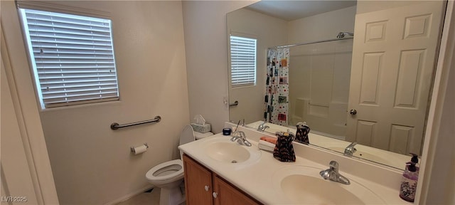 bathroom with a shower with shower curtain, vanity, and toilet