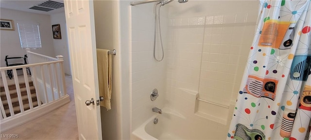 bathroom with shower / bath combo