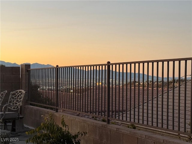 view of gate at dusk