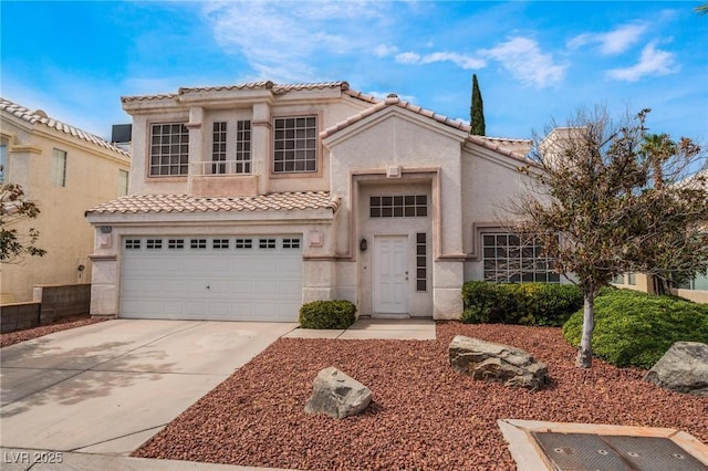 mediterranean / spanish house featuring a garage