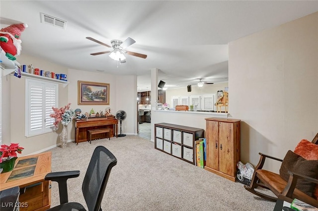 home office with light colored carpet and ceiling fan