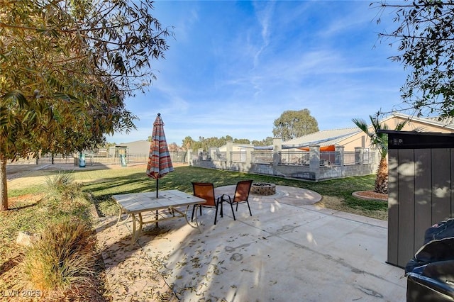 view of patio / terrace featuring an outdoor fire pit