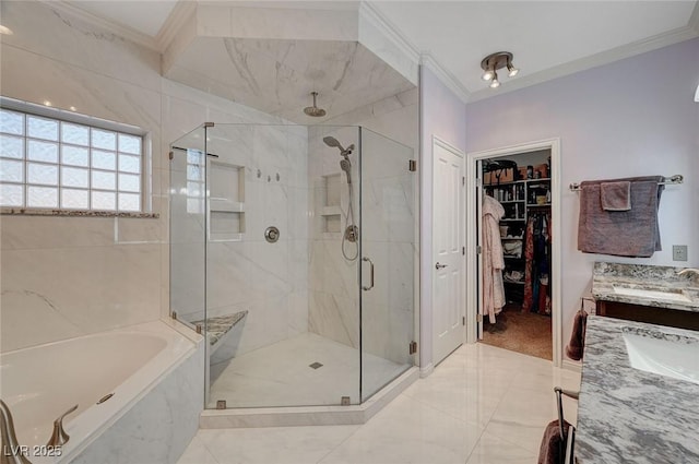 bathroom with crown molding, sink, and independent shower and bath