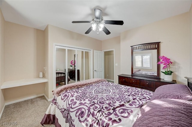 bedroom featuring light carpet, a closet, and ceiling fan