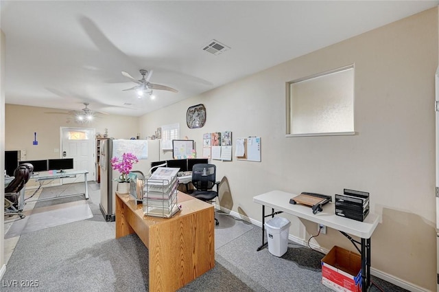 office space featuring ceiling fan and light carpet