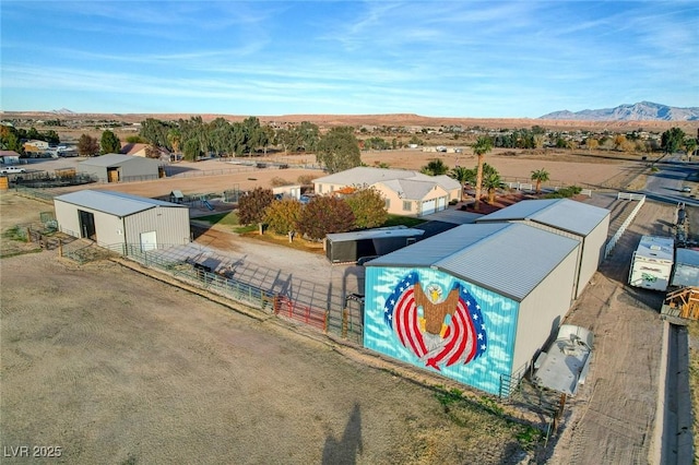 birds eye view of property featuring a mountain view