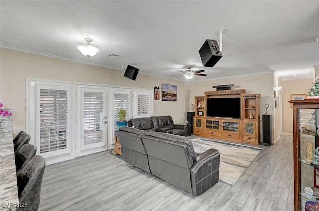 living room with ceiling fan, light hardwood / wood-style flooring, and ornamental molding