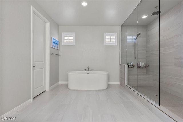 bathroom with separate shower and tub