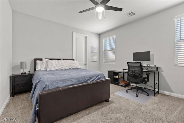 bedroom with ceiling fan and light colored carpet