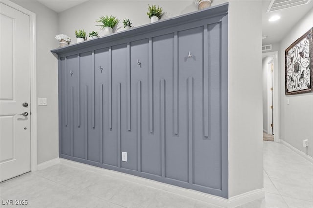 mudroom with light tile patterned floors