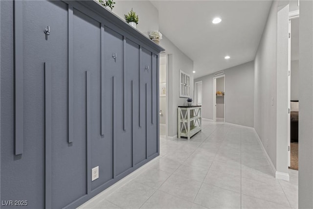 hallway featuring light tile patterned flooring