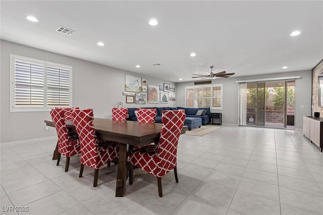 dining room with ceiling fan and light tile patterned flooring