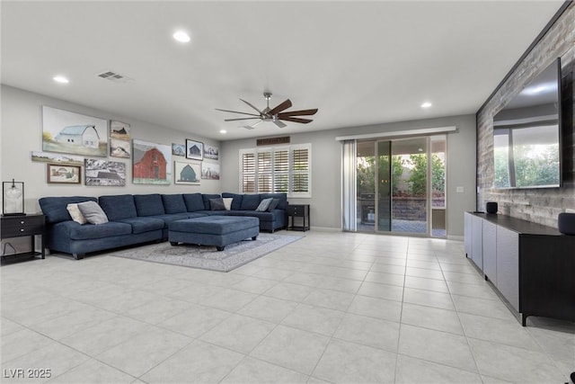 living room with light tile patterned floors and ceiling fan