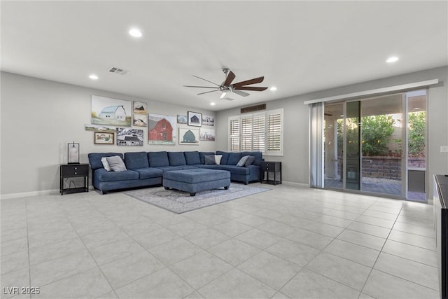 living room with ceiling fan and light tile patterned floors