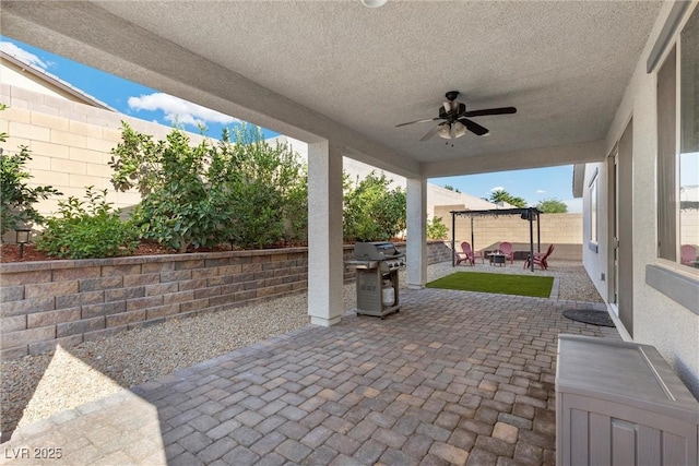 view of patio / terrace featuring ceiling fan and area for grilling