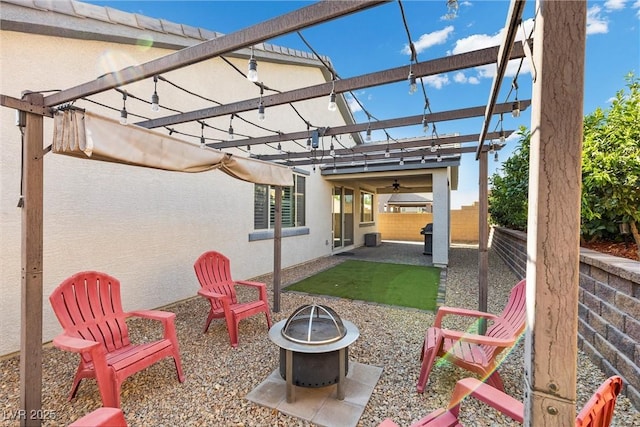 view of patio with a pergola and an outdoor fire pit