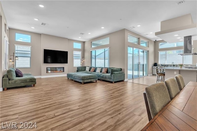 10301 Fairview Ridge Ct, Las Vegas, NV 89166 - living area with recessed lighting, a healthy amount of sunlight, and light wood-style floors