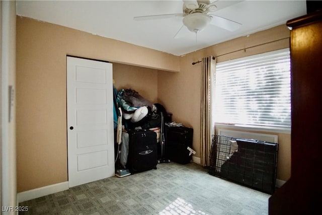 bedroom with ceiling fan and light carpet