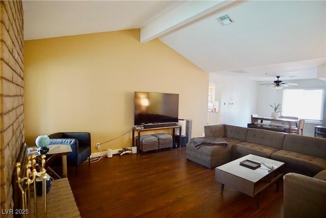 living room featuring ceiling fan, a large fireplace, dark hardwood / wood-style flooring, and lofted ceiling with beams