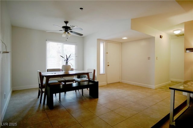 dining room featuring ceiling fan and light tile patterned flooring