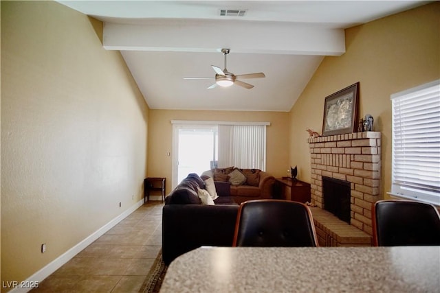 tiled living room featuring a brick fireplace, lofted ceiling with beams, and ceiling fan