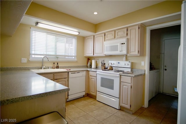 kitchen with white appliances, sink, and light tile patterned floors