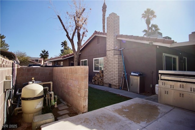 view of property exterior featuring a patio