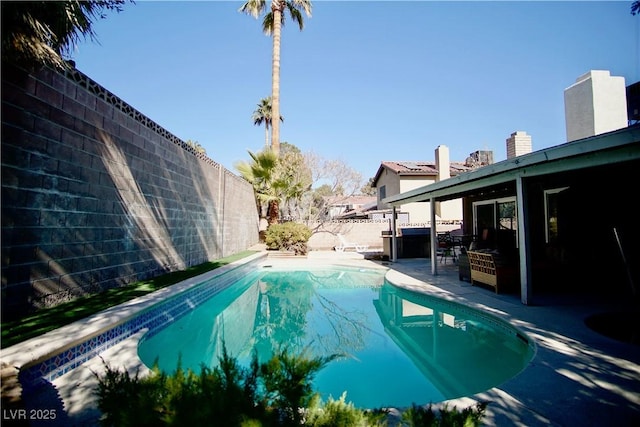 view of swimming pool featuring a patio area