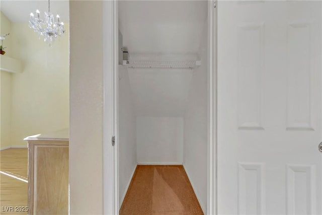 bathroom with a chandelier