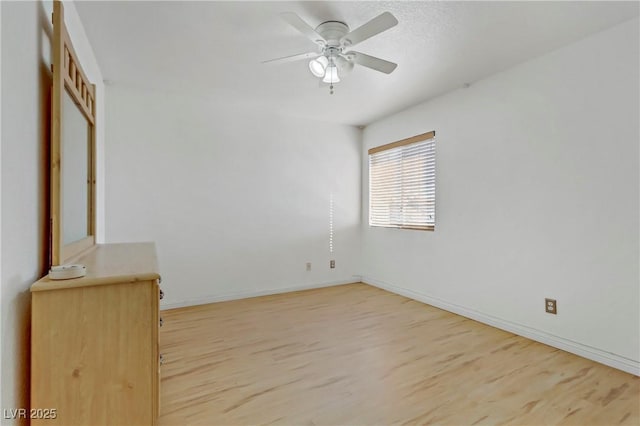 spare room with ceiling fan and light hardwood / wood-style floors