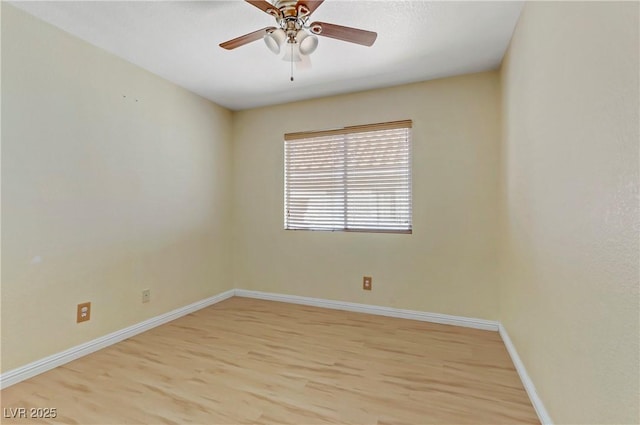 empty room with ceiling fan and light wood-type flooring