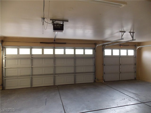 garage featuring a garage door opener