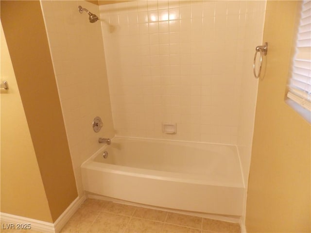 bathroom featuring tile patterned floors and tiled shower / bath combo