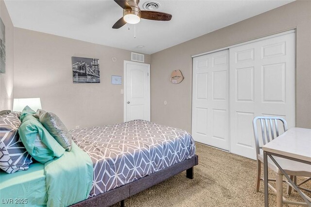 bedroom with carpet flooring, ceiling fan, and a closet