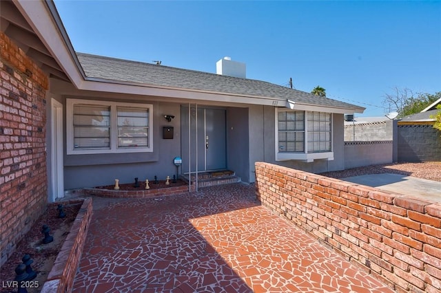 property entrance featuring a patio area