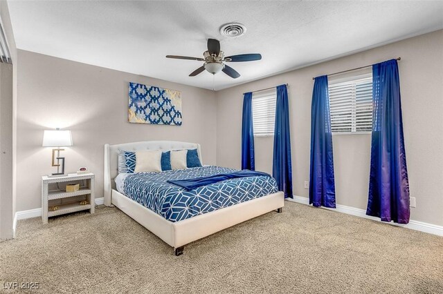 bedroom with ceiling fan and carpet