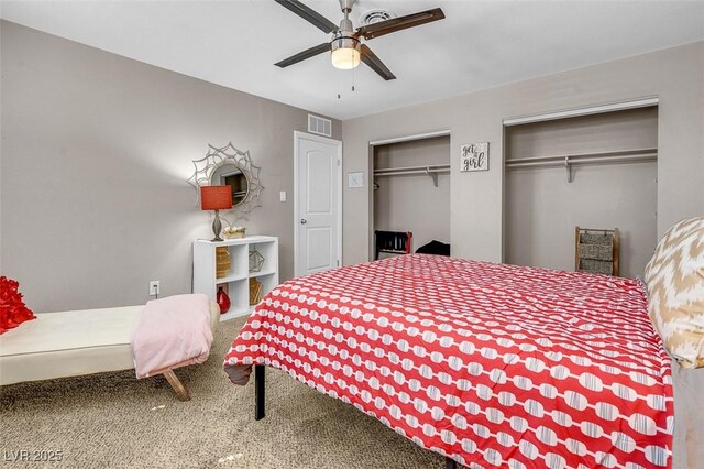 bedroom with carpet, ceiling fan, and multiple closets