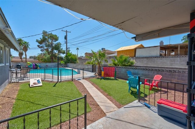 view of yard featuring a patio area and a fenced in pool