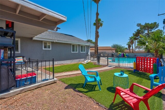 view of yard with a patio area and a fenced in pool