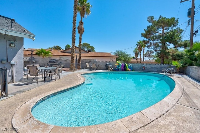 view of swimming pool featuring a patio area